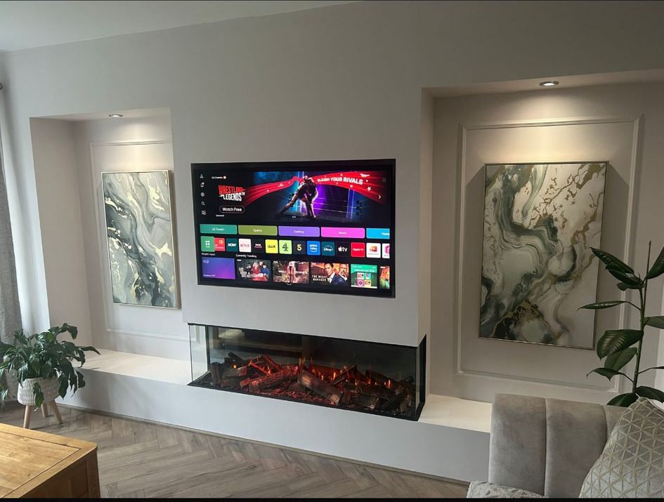 Bespoke media wall with 3-sided inset fire and panelled alcoves by North West Media Walls